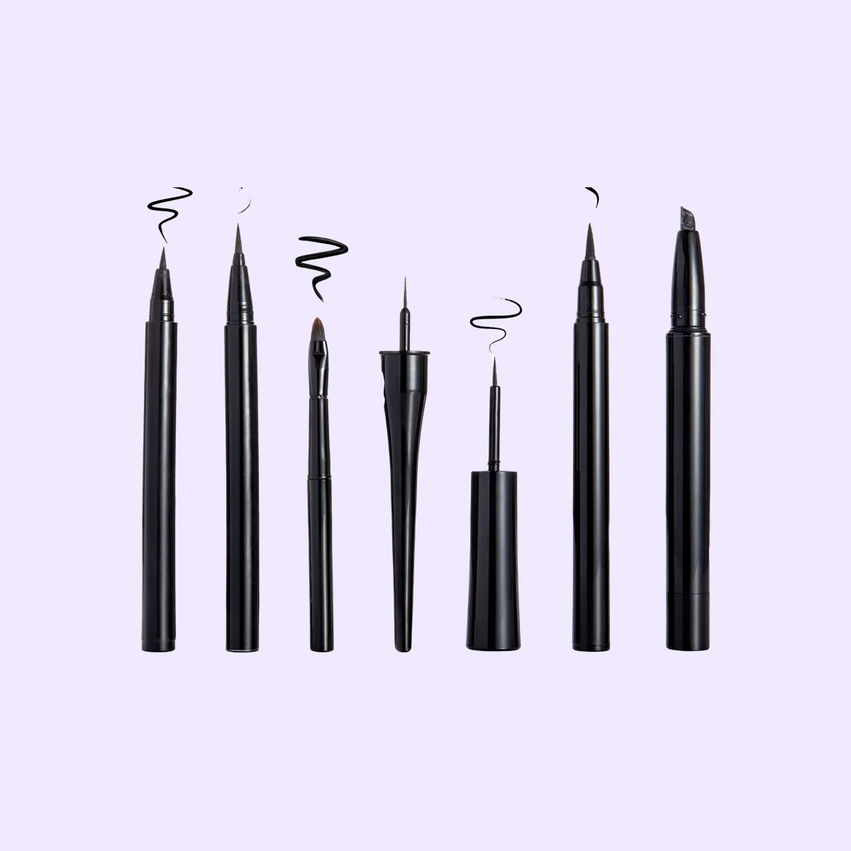 Set of eyeliner and stroke isolated on light purple